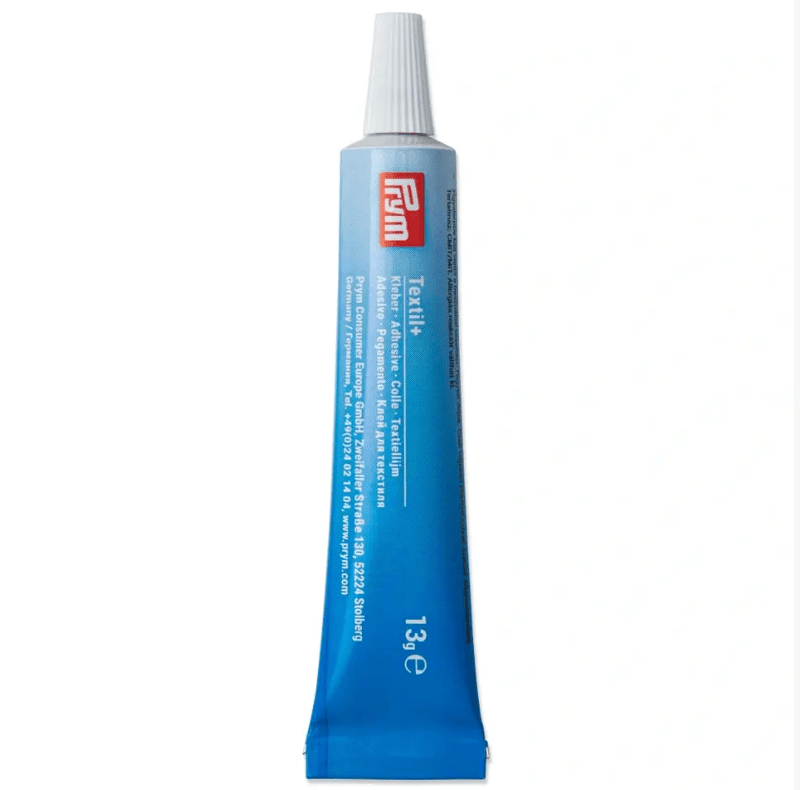 Textil+ transparent fabric glue in a 13g tube.
