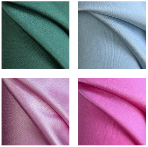 Four swatches of stretch silk satin fabric in forest green, sky blue, pink, and candy pink.