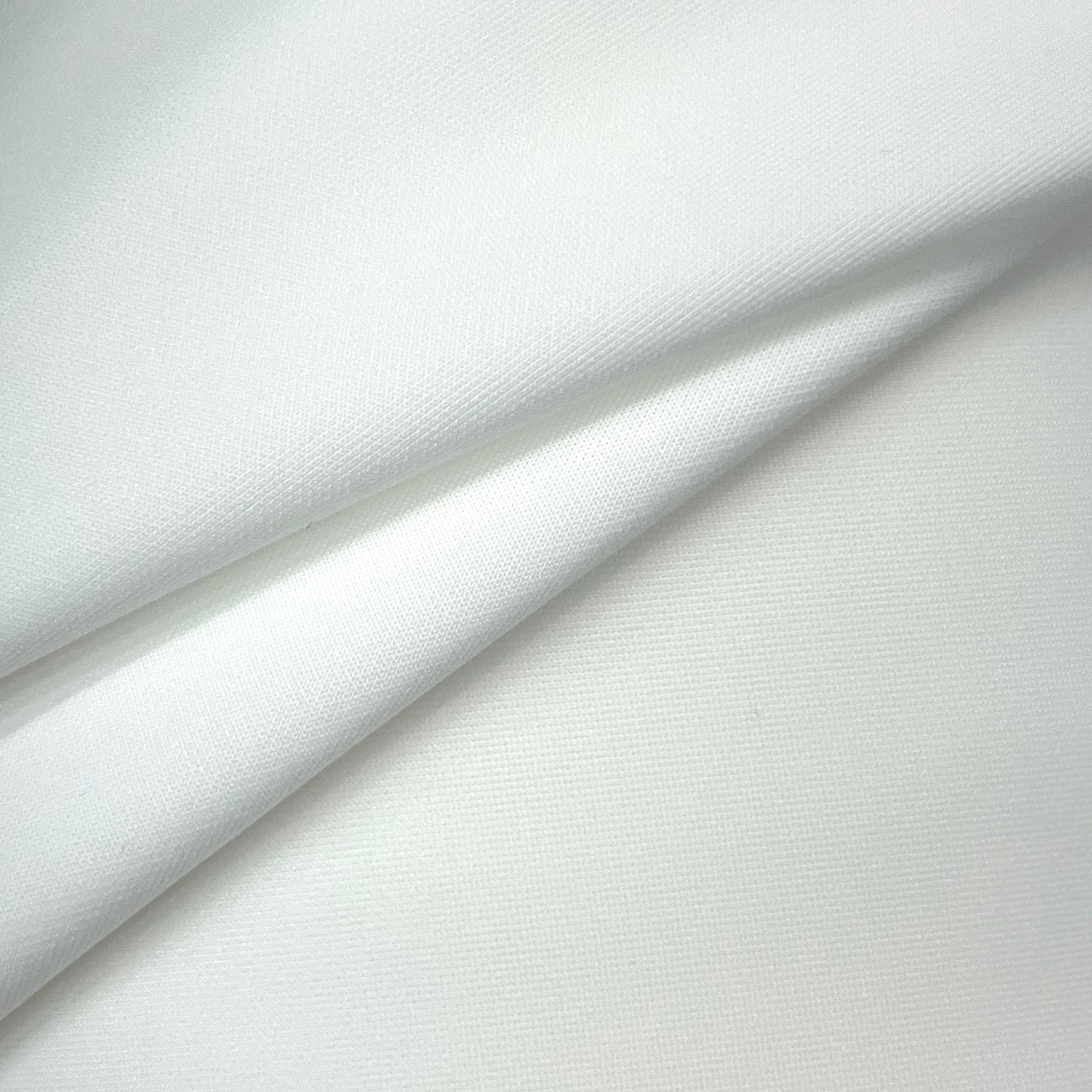Close-up of white fabric with subtle texture