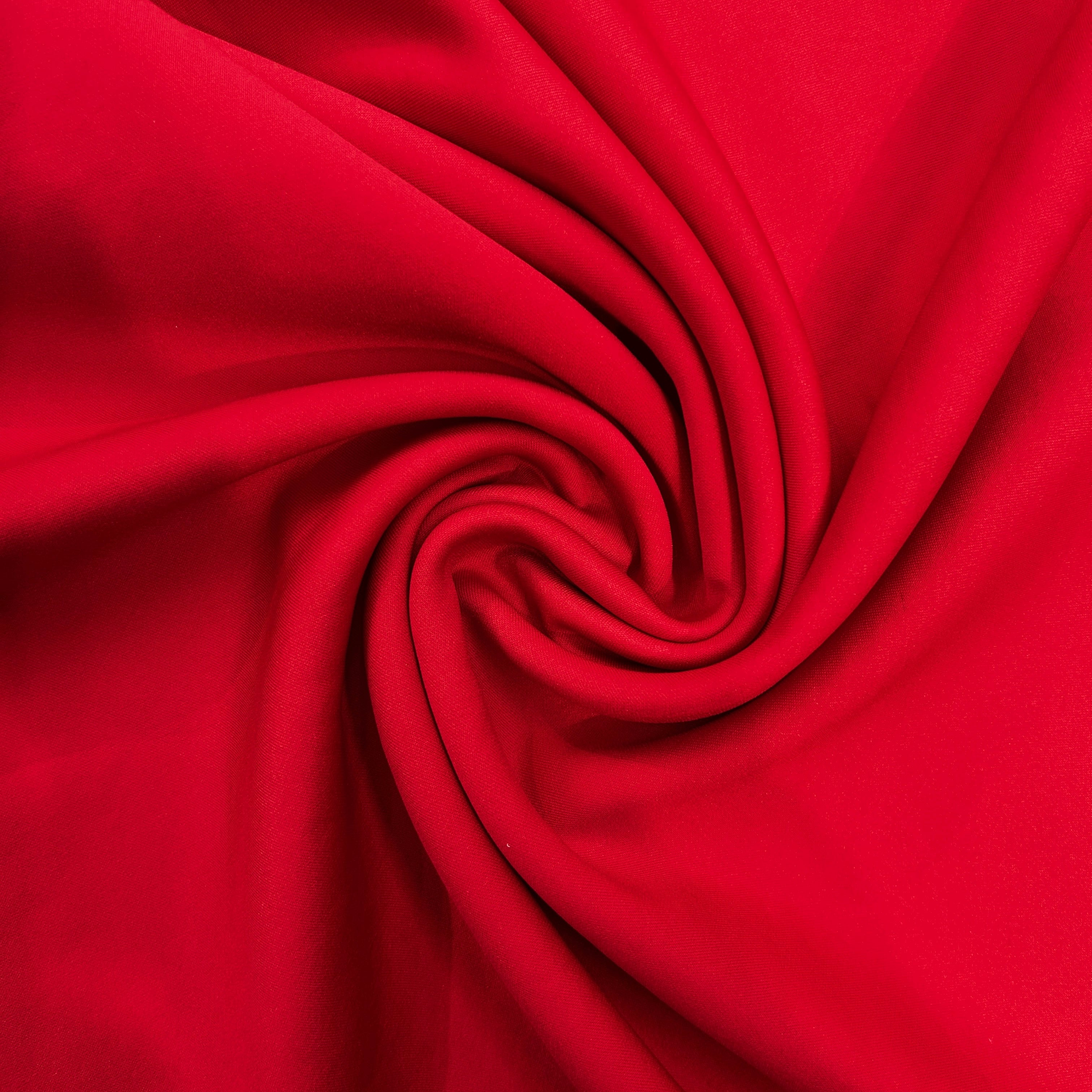 Close-up of red fabric with a swirl pattern