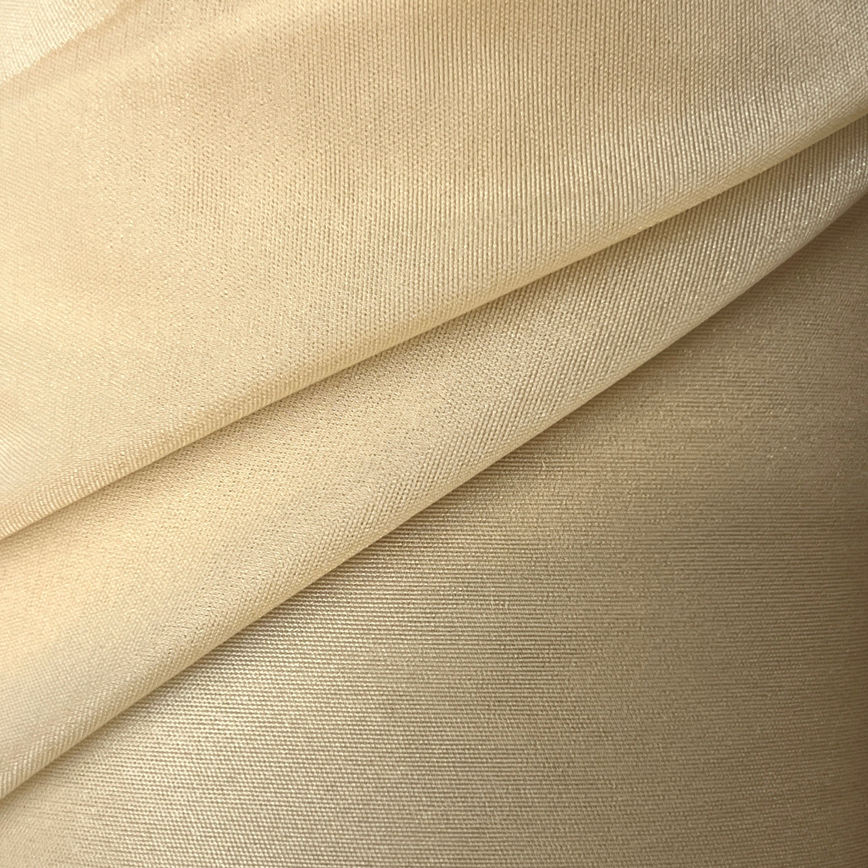 Close-up of beige fabric with a subtle texture