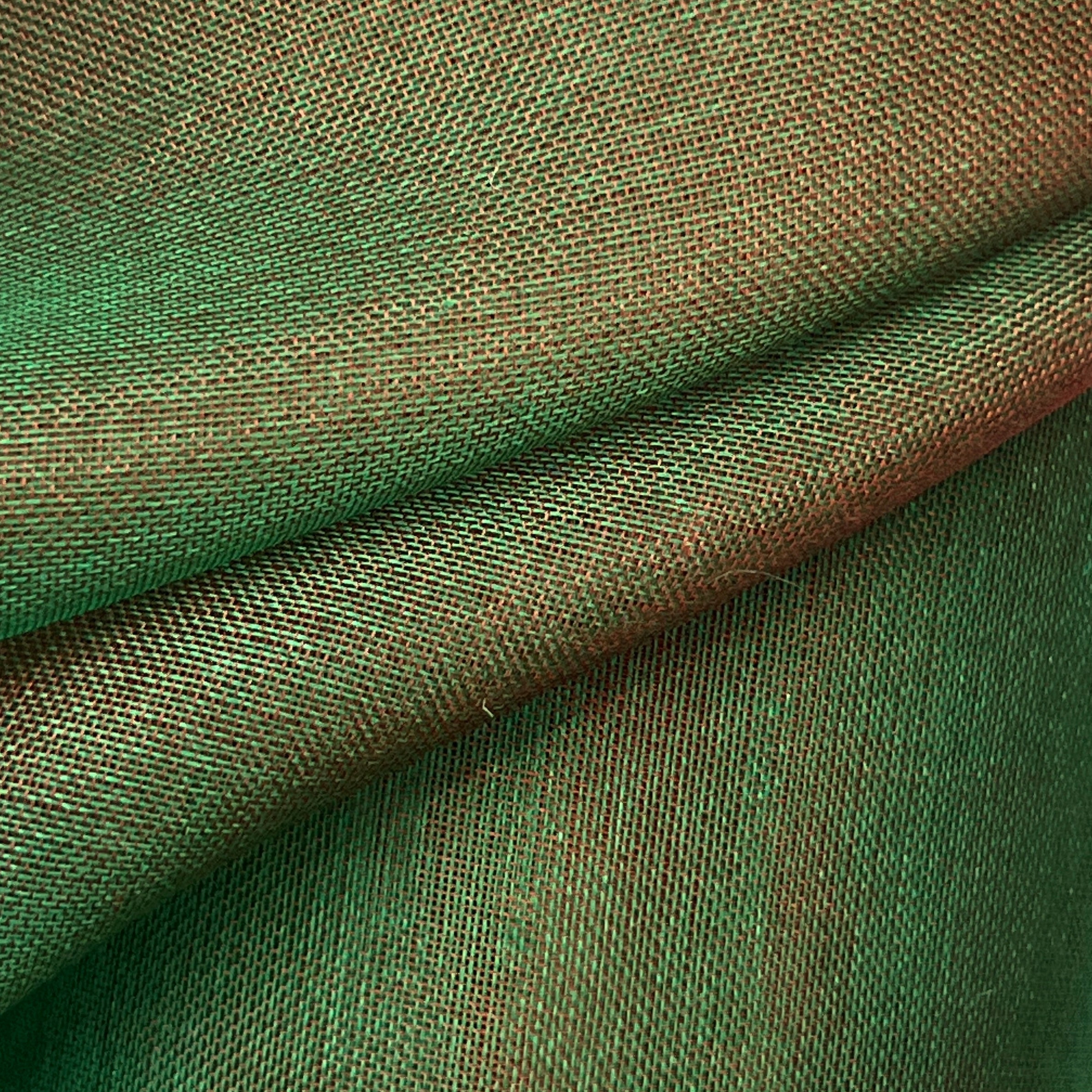 Close-up of green fabric with a textured pattern