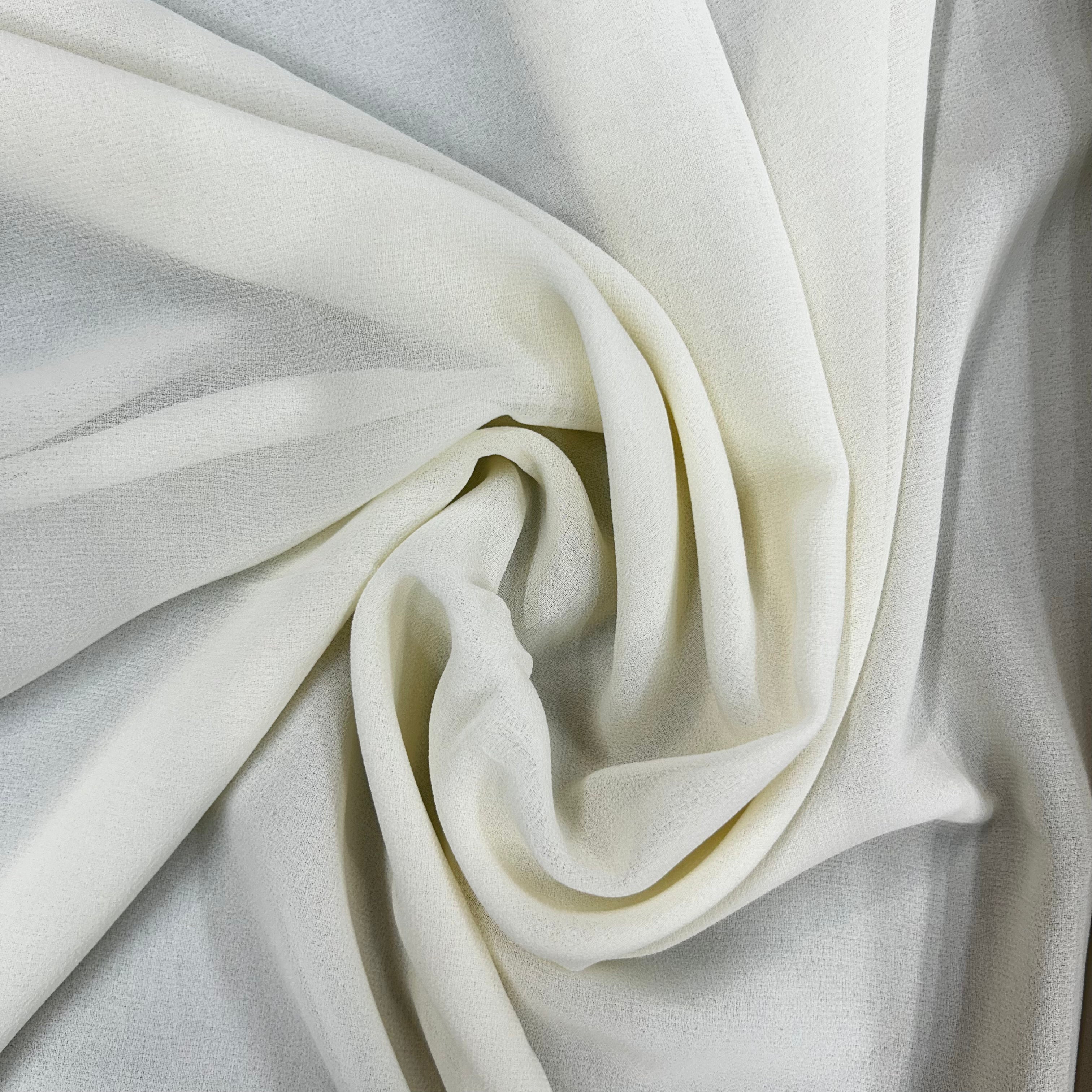 Close-up of white fabric with folds