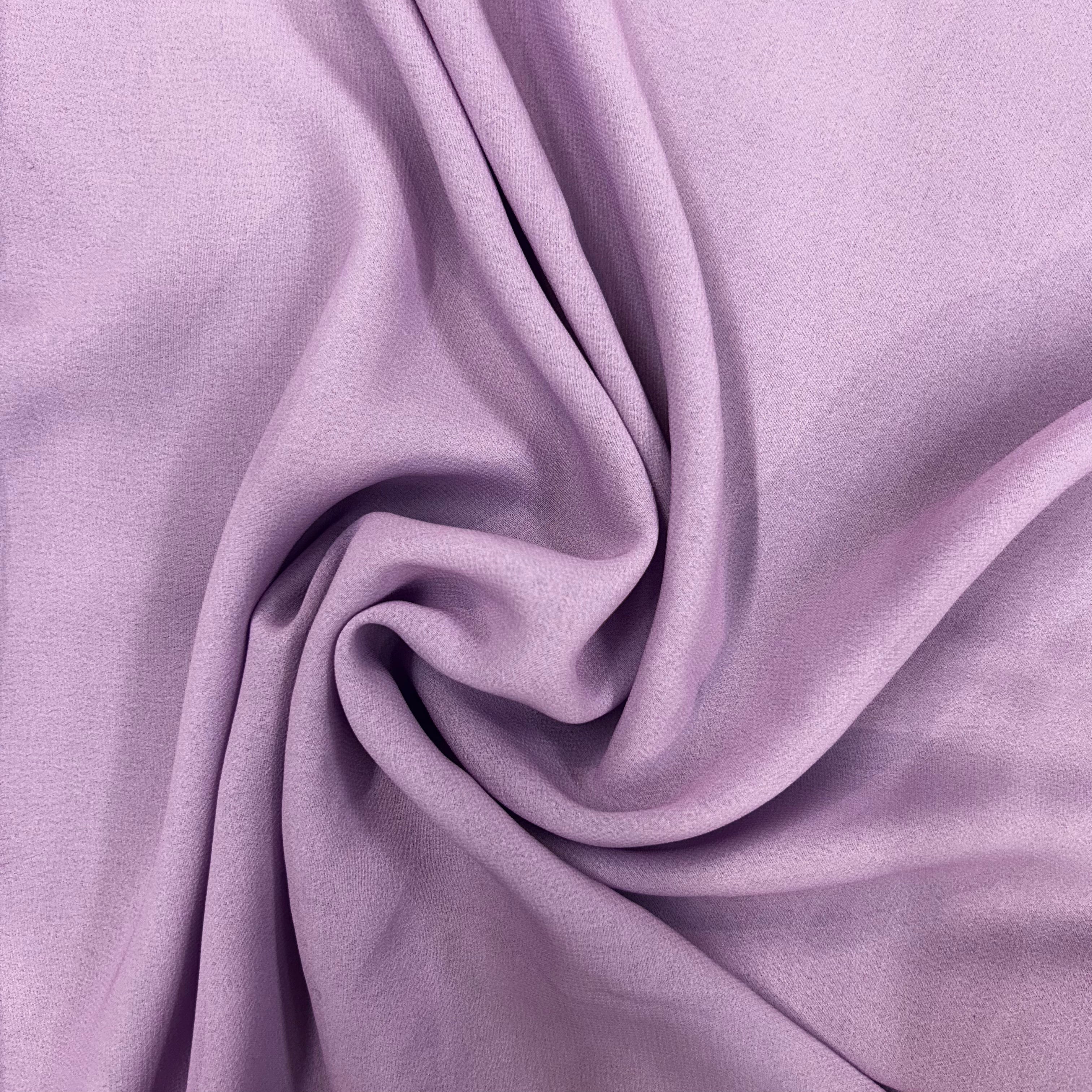 Close-up of purple fabric with folds