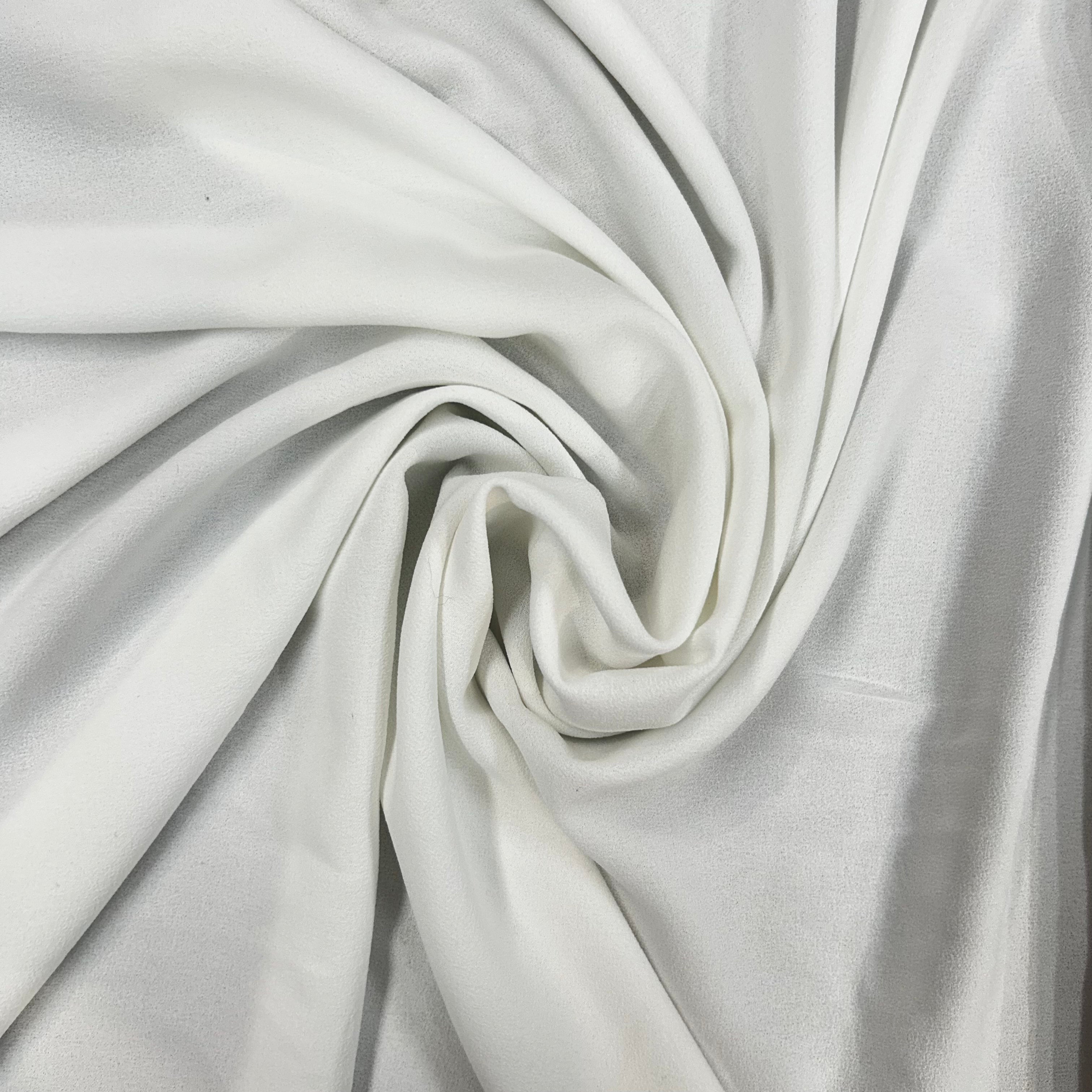 Close-up of white fabric with folds