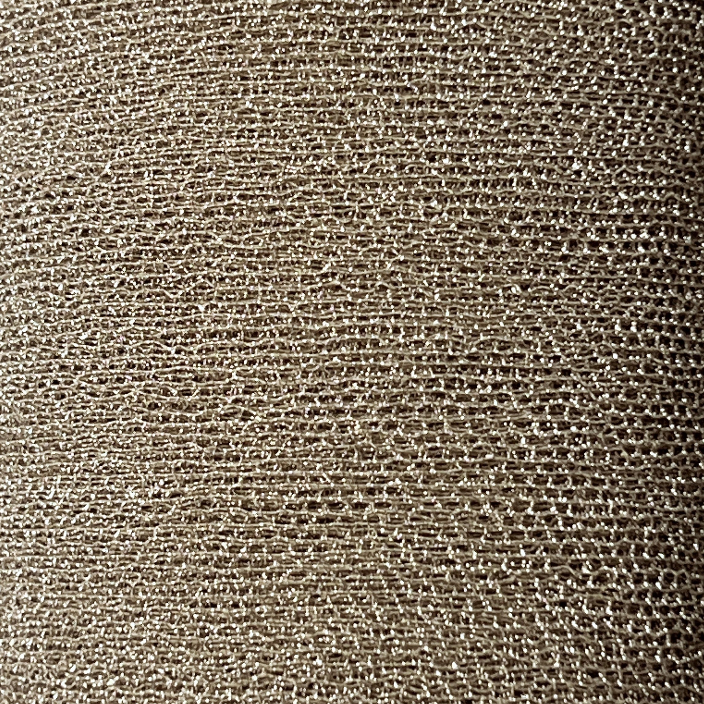 Close-up of a textured brown fabric surface