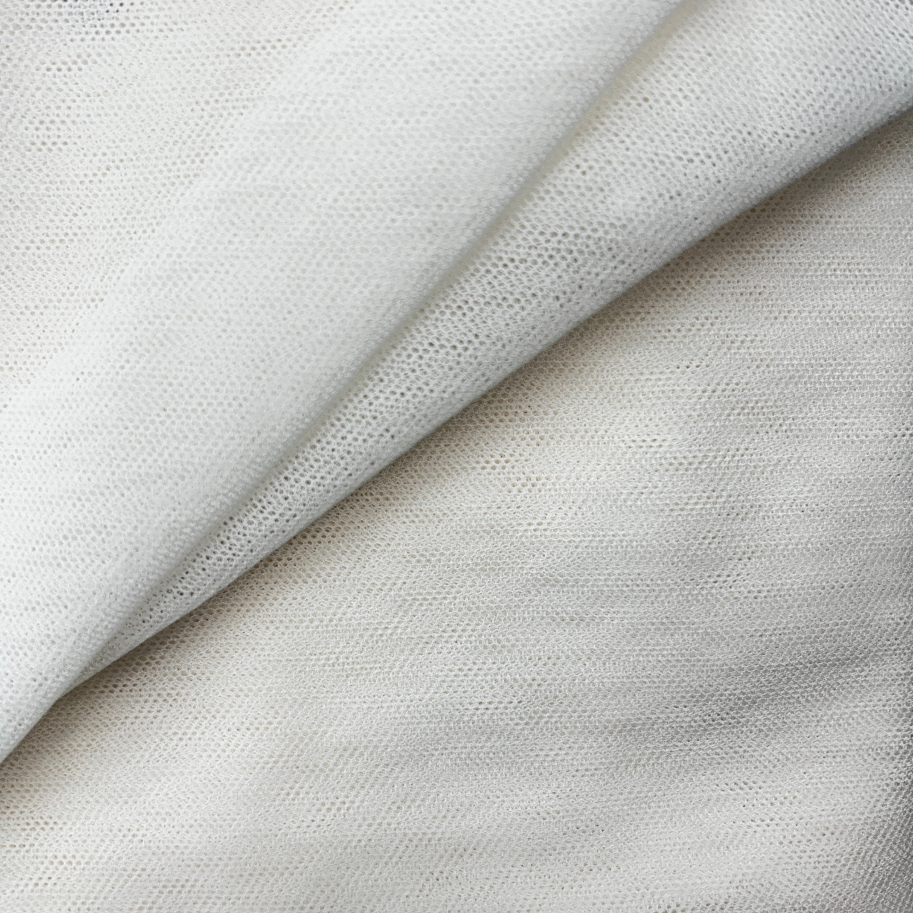 Close-up of light gray fabric with a textured pattern