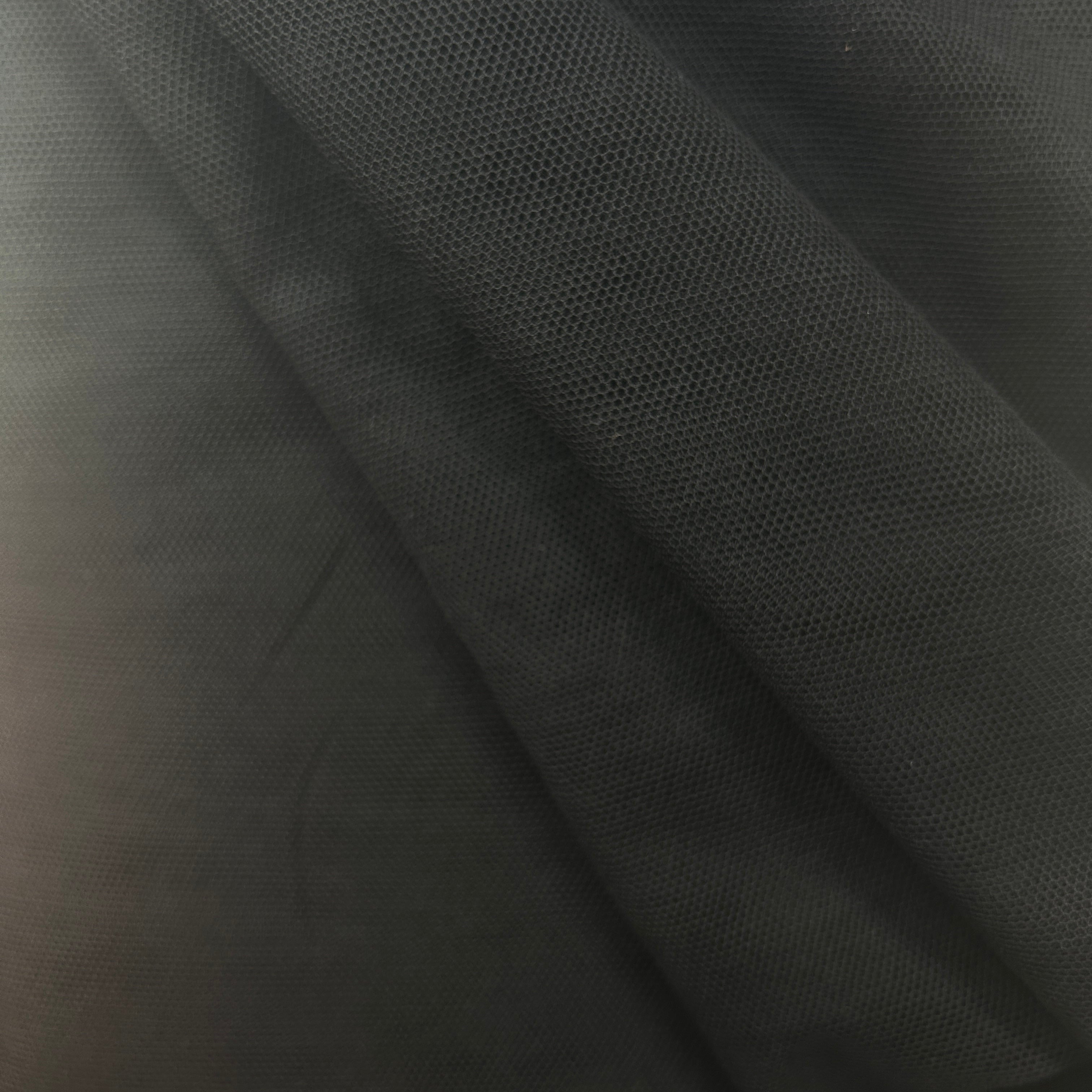 Close-up of dark gray fabric with a textured pattern