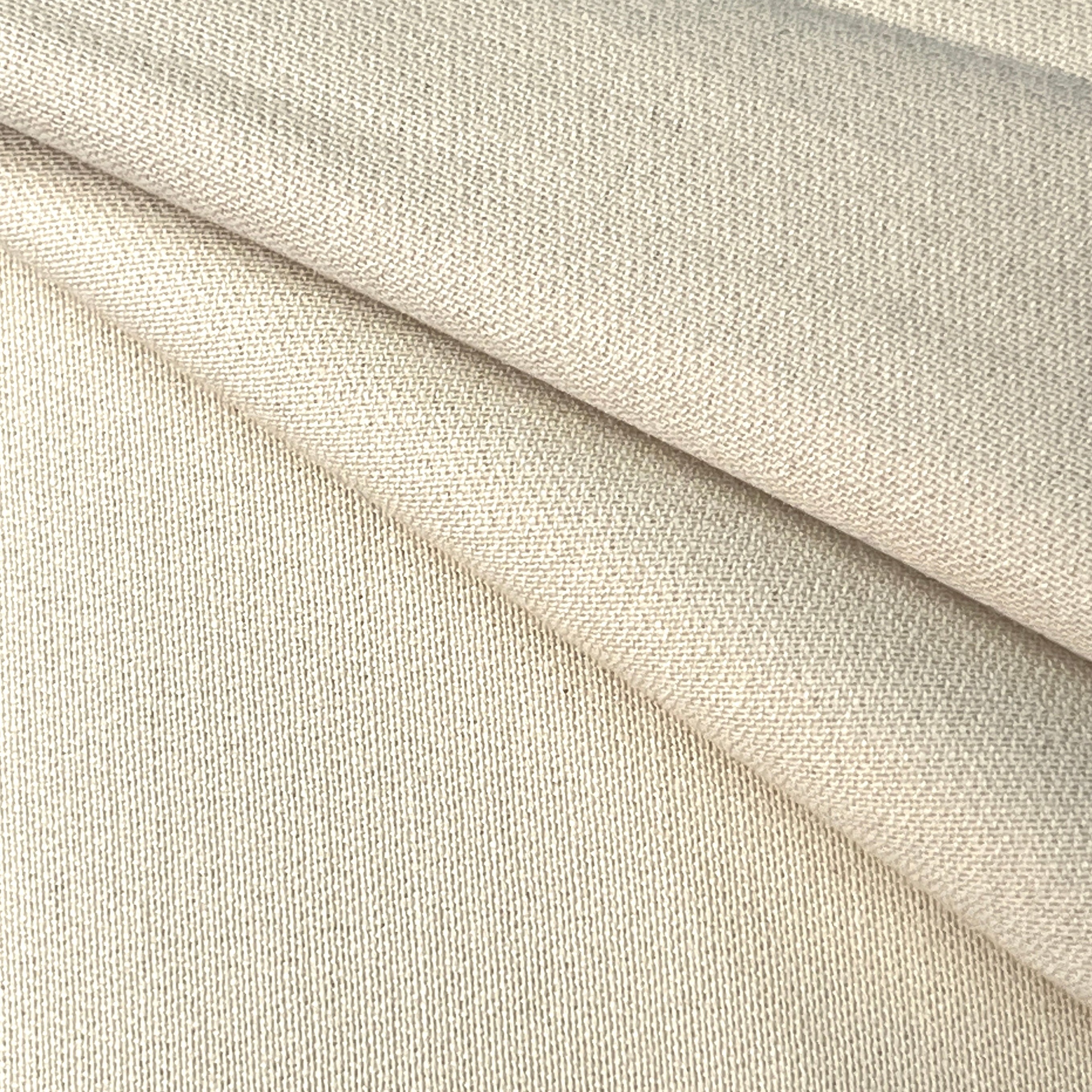 Close-up of beige fabric with a subtle texture