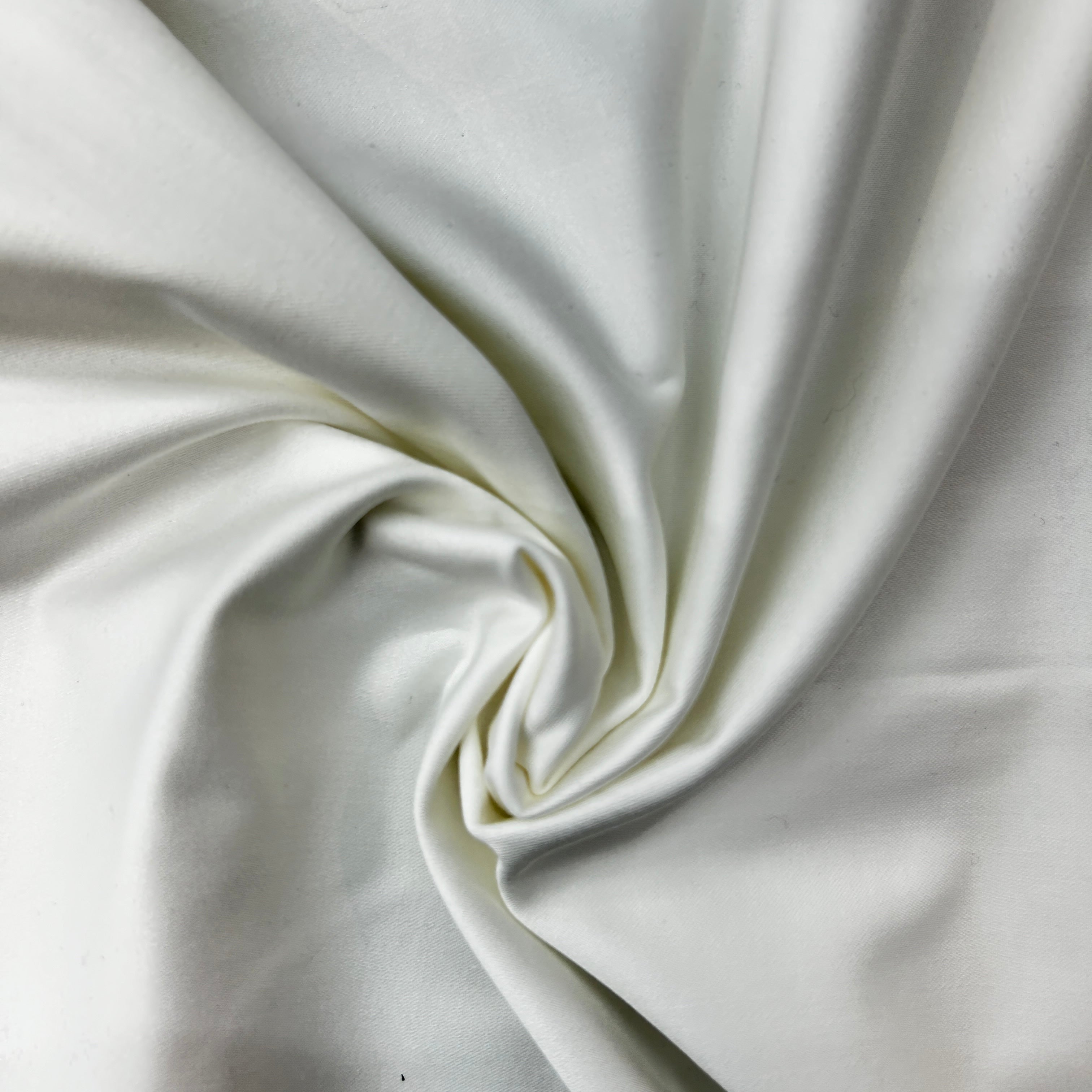 Close-up of white fabric with folds