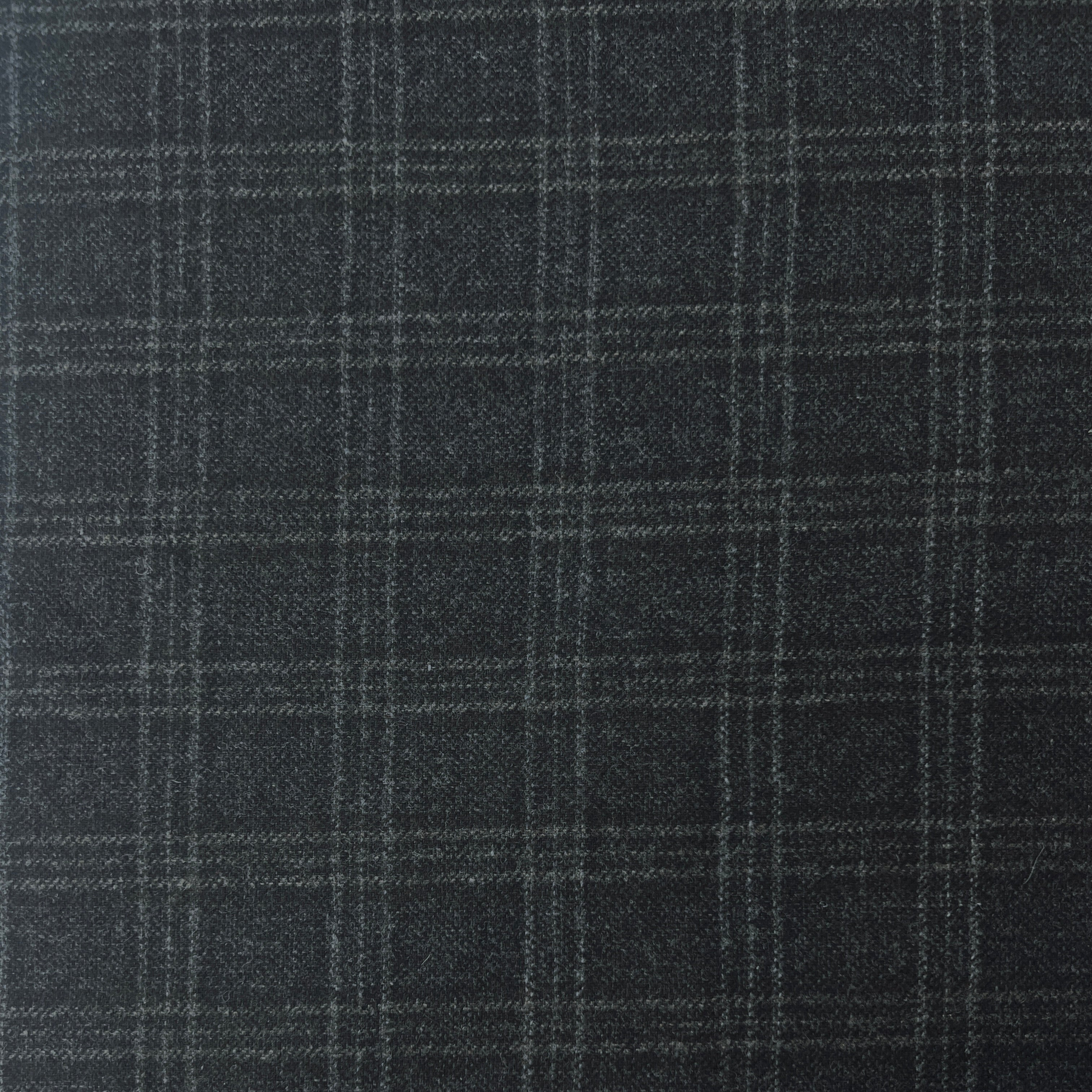 Close-up of dark gray fabric with a subtle check pattern