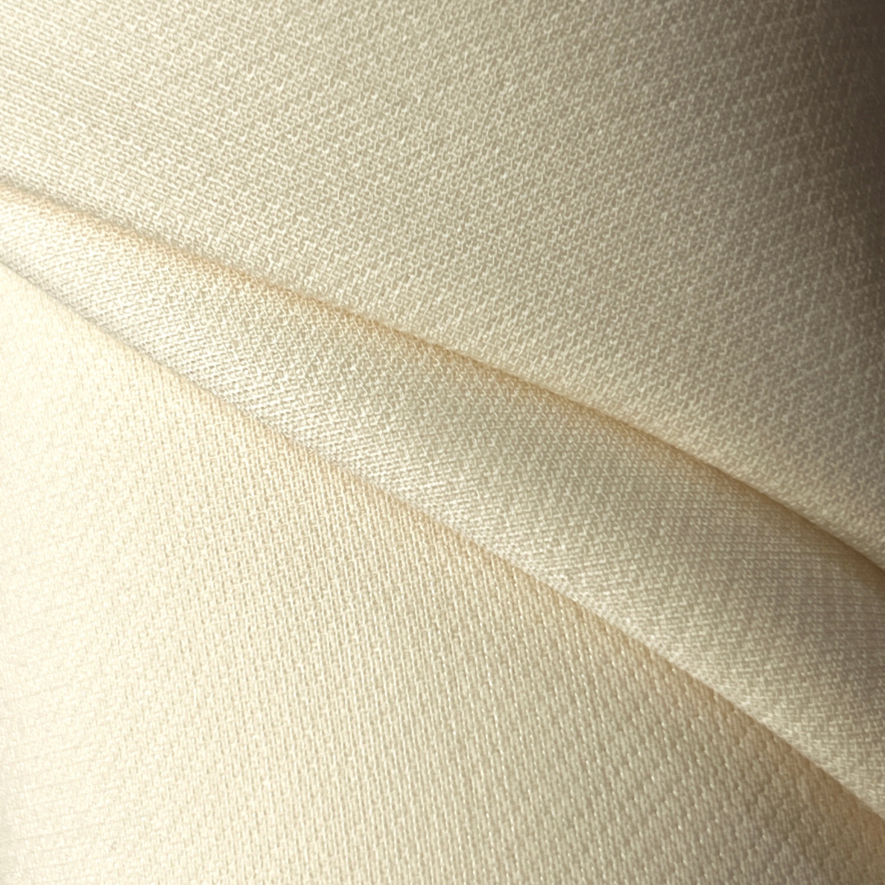 Close-up of beige fabric with visible texture