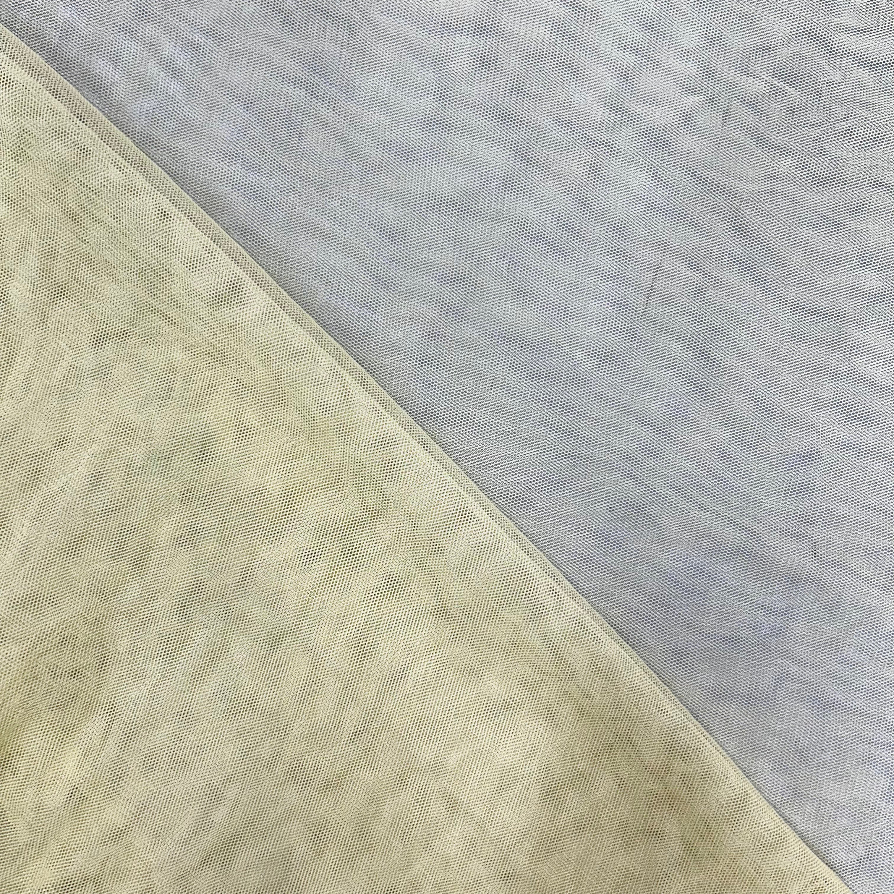 Two fabric swatches, one beige and one gray, on a diagonal.