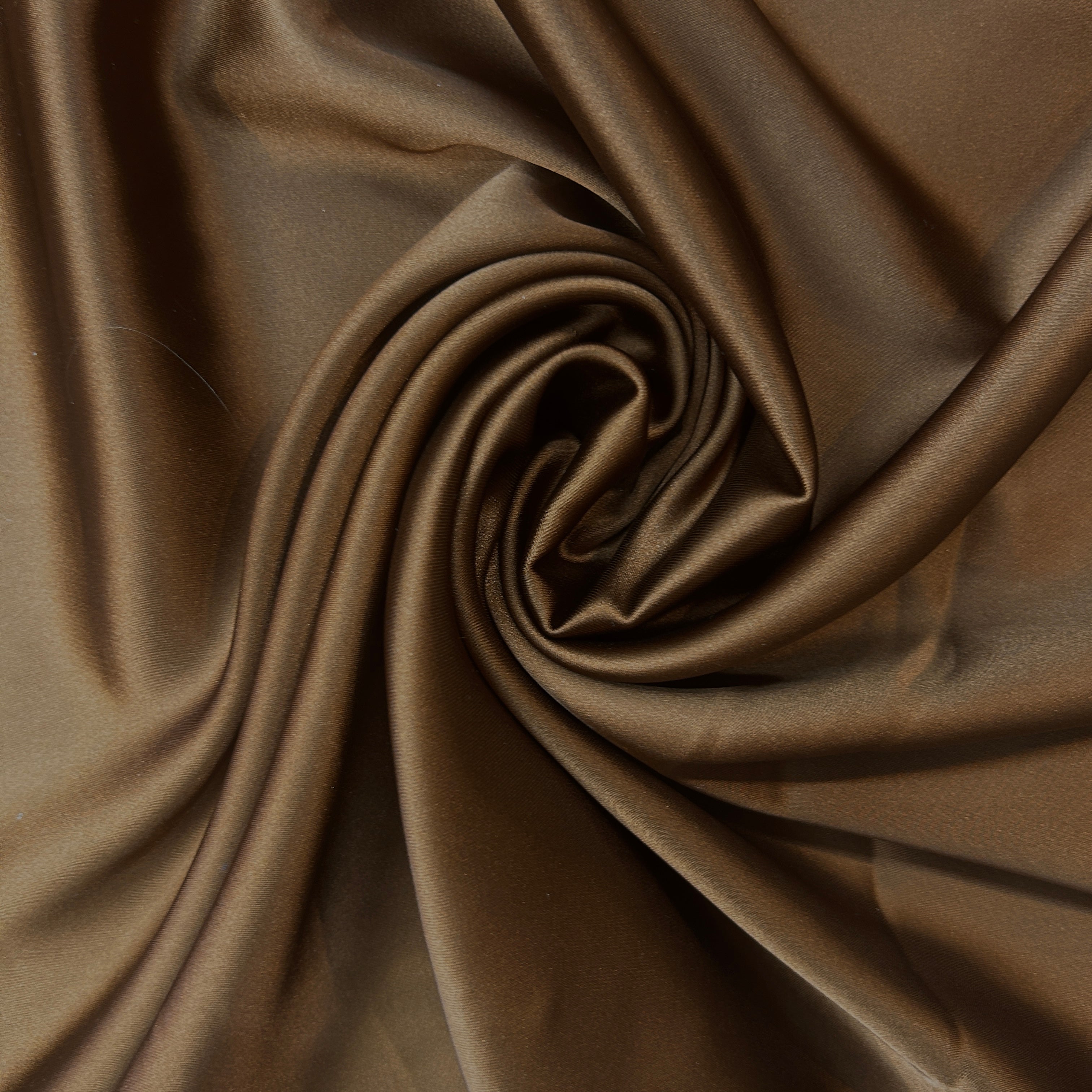 Close-up of brown fabric with folds