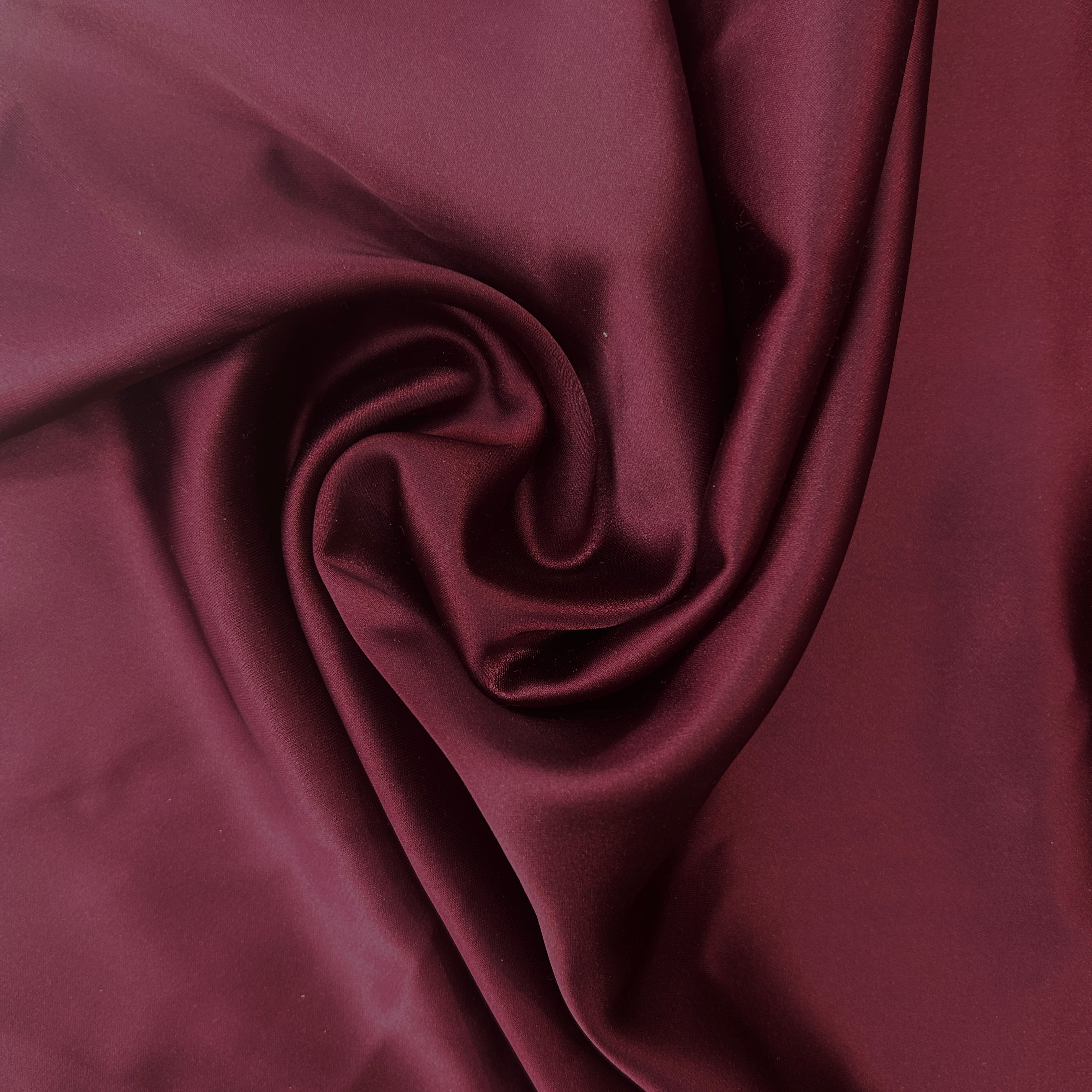 Close-up of dark red fabric with folds